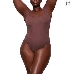 SKIMS Ribbed Stretch Cotton Bodysuit In Garnet